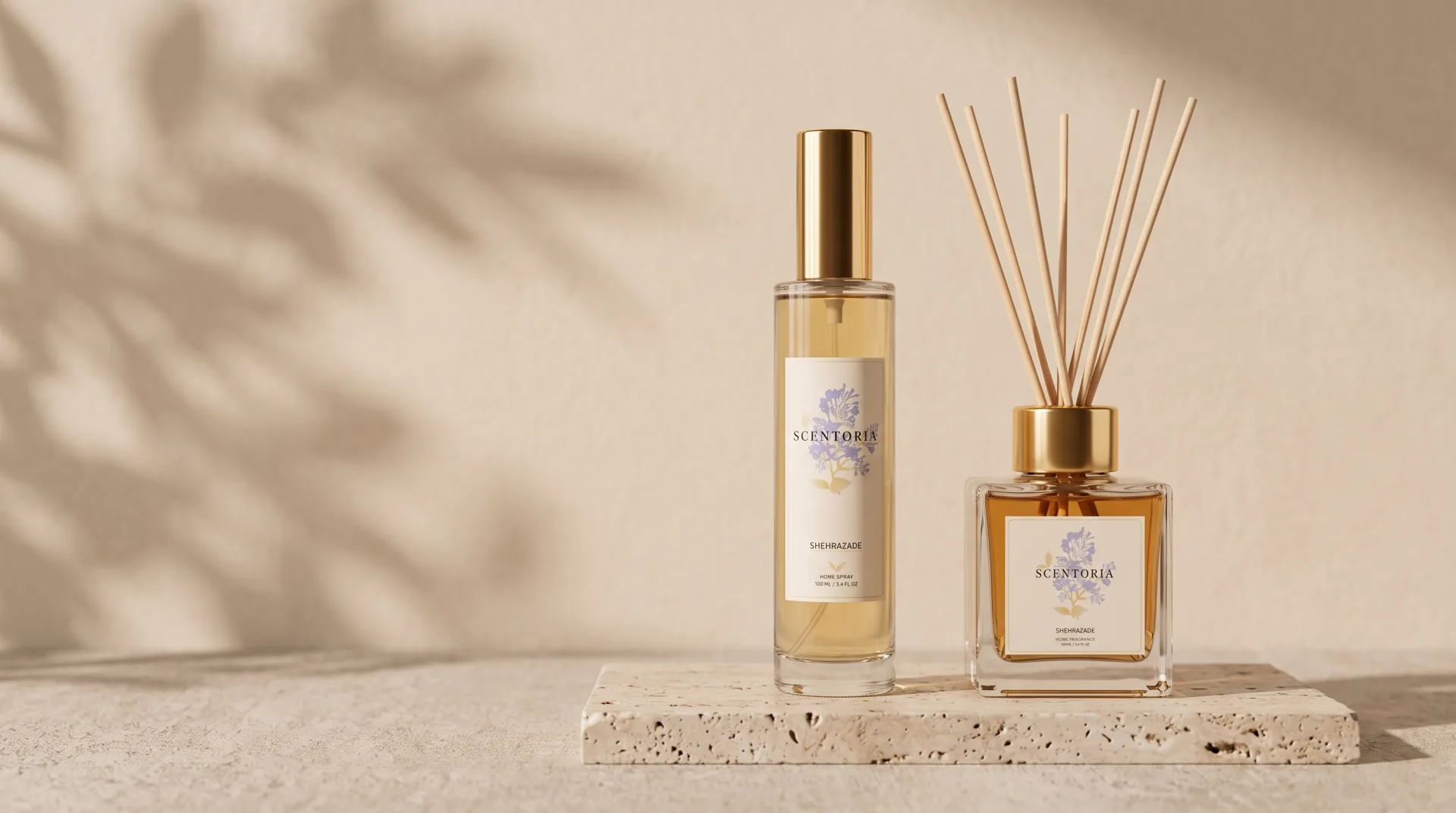 A Scentoria home spray and reed diffuser standing together on one travertine stone in warm noon light
